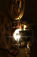 Fototapeta premium film projector with dramatic lighting and selective focus
