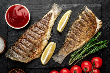 grilled sea bass with spices on a stone background