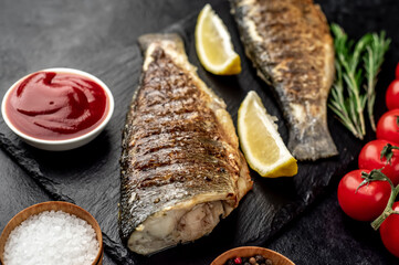 grilled sea bass with spices on a stone background