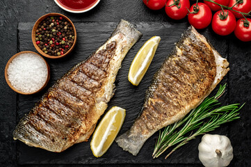 grilled sea bass with spices on a stone background