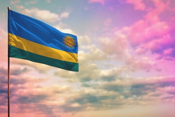 Fluttering Rwanda flag mockup with the space for your content on colorful cloudy sky background.