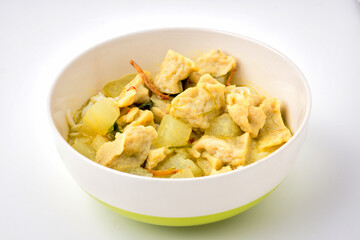 green curry fish ball  with fermented rice flour noodles in white bowl isolated on a white background, Thai food.