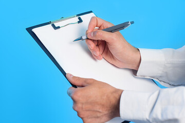 Psychologist writing notes or prescription during therapy session. Doctor hold clipboard Psychotherapy counseling