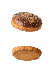two halves of a brown sesame seed bun
