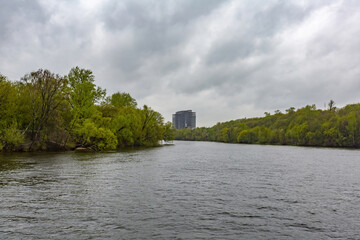 River landscape on a May day in cloudy rainy weather. Moscow river, Russia