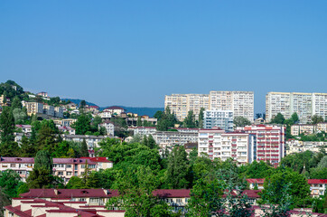 Apartment buildings in the hills. Red roofs
