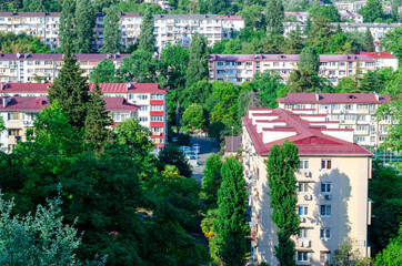 City block from above. Apartment buildings. Sunlight