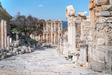 Fototapeta na wymiar Celsus Library in Ephesus in Selcuk (Izmir), Turkey. Marble statue is Sophia, Goddess of Wisdom, at the Celcus Library at Ephesus, Turkey. The ruins of the ancient antique city.