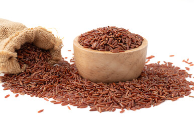 Red rice (brown rice)  in a wooden and sack, Red rice are scattered on the ground.