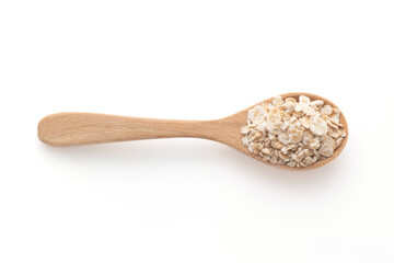 Oatmeal in spoon isolated on a white background, top view.
