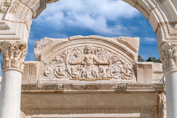 Celsus Library in Ephesus in Selcuk (Izmir), Turkey. Marble statue is Sophia, Goddess of Wisdom, at the Celcus Library at Ephesus, Turkey. The ruins of the ancient antique city.