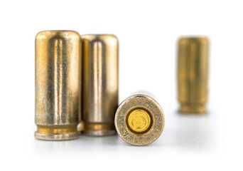 Bullets for a gun isolated on white background with reflection, cartridges for pistol 9mm, illustrative photo