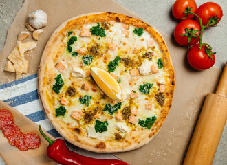 pizza close up. Top view. Italian pizza with vegetables and other ingredients.on parchment paper