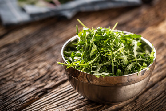 Freshly plucked rucola served as a side dish in metal bowl