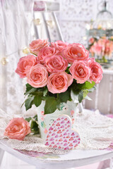 bunch of pink roses and a heart decor in shabby chic style