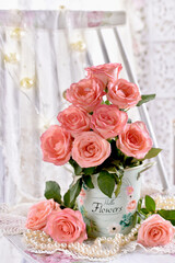 bunch of pink roses and pearls in shabby chic style