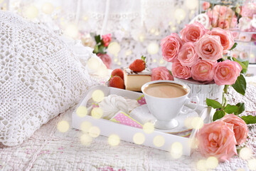 Fototapeta na wymiar coffee and roses on the bed in romantic style