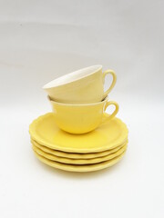 Mid-century modern yellow porcelain cups pattern isolated