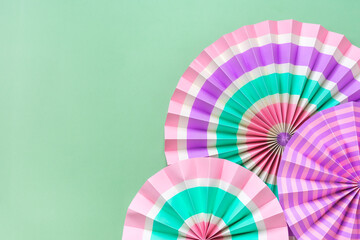 Traditional Japaneses festival paper fan with pink, turquoise, white stripes Birthday party, celebration holidays concept Abstract background Wall decor Banner	 - obrazy, fototapety, plakaty