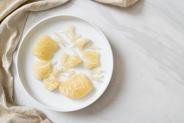 Fresh peeled pomelo, grapefruit or shaddock