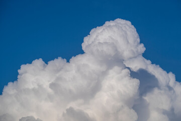 White big cloud against the blue sky background