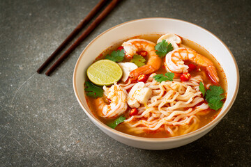 instant noodles ramen in spicy soup with shrimps (Tom Yum Kung)
