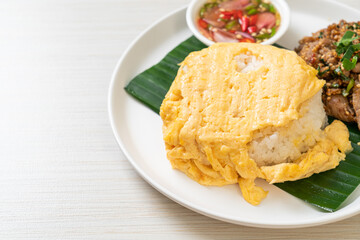 egg on topped rice with grilled pork and spicy sauce