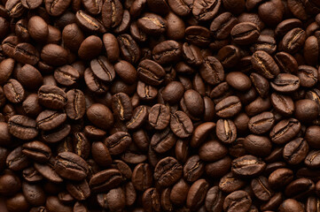 Roasted coffee beans background. Close up top view.