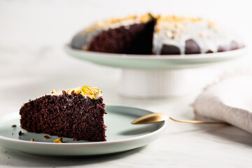 Homemade brownie cake with pistachios in icing.