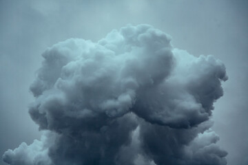Large dramatic cloud on a cloudy sky. Emission of factory, air pollution.