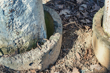 Damaged pipeline. The old pipe goes into the ground.