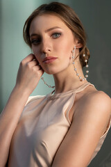 pretty young model looking in camera with big earring