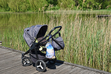 Baby carriage at the lakeside