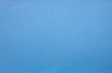 Close-up background texture of blue concrete cement wall of a building in rural Thailand..