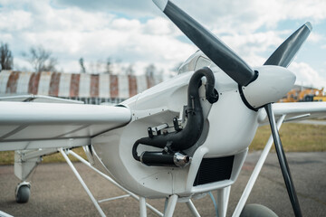 close up of engine and propeller of remote radio controlled light airplane