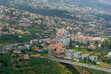 Naklejka na ściany i meble highway crossing the city in Funchal, Madeira Island urban area