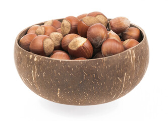 Unpeeled hazelnuts in a cup isolated on white background. hazelnuts in shell