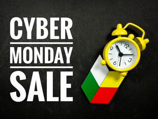 Text CYBER MONDAY SALE with colorful wooden jigsaw and alarm clock on black background.