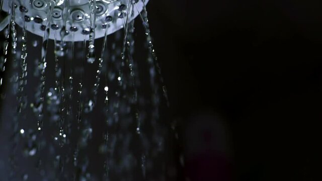 Shower flowing in close-up and slow motion