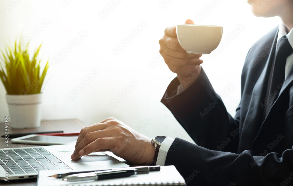 Poster shot of man hand using and typing keyboard of laptop computer on office desk. workspace, businessman