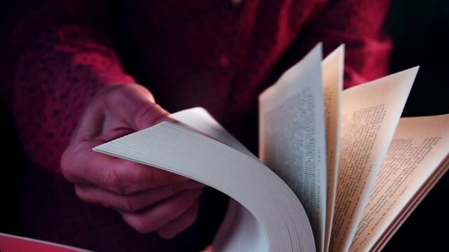 Turning pages of the book, close-up.  Slow motion video of an old book's page turning
