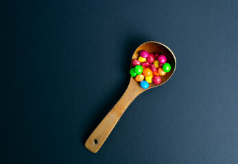 colorful little candies on a colored background
