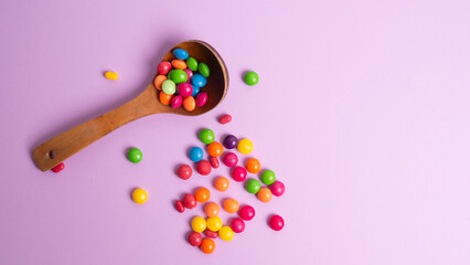 colorful little candies on a colored background