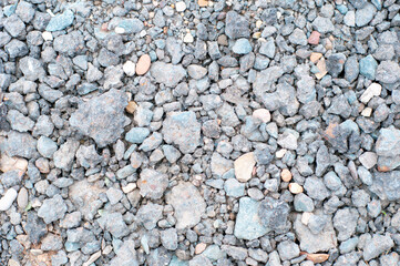 background texture of rocks and crushed asphalt