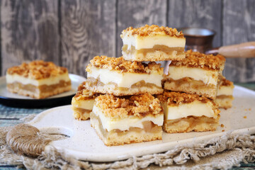 Grated apple pie with custard and cezve for coffee breaks