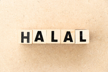 Alphabet letter block in word halal on wood background