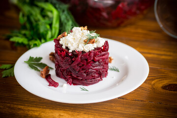 dietary salad of boiled beets with walnuts and cottage cheese