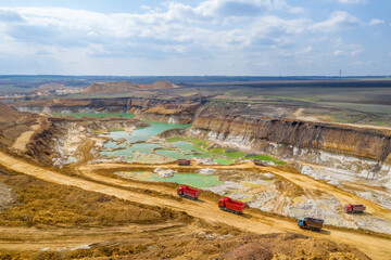 Quarry, mining and construction, excavators and trucks, view from above