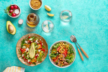 Summer healthy vegetables salads with avocado, cucumber, radish, bell pepper and tomato. Summer healthy vegetable salad. Healthy food.Top view.