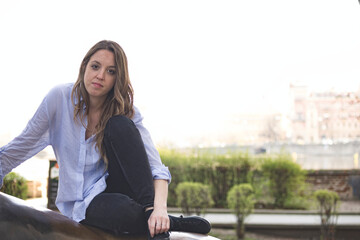 Fototapeta premium Portrait of a young girl sitting on vacation